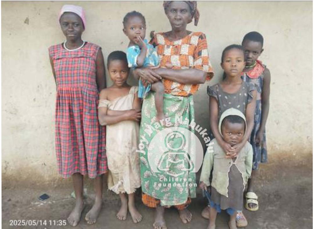 A mother and her kids posing for a photo.